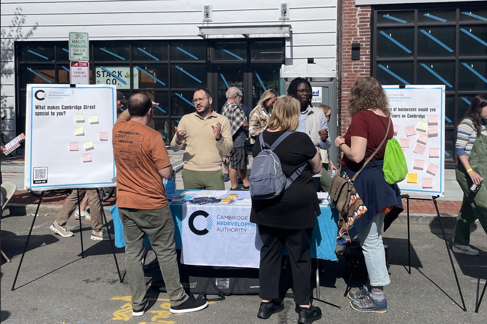 engaging the public on the street with a booth with signs