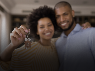 photo of a couple holding a pair of house keys