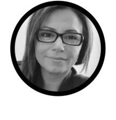 Headshot of Stacy Bliagos. Executive Director, HANAC Inc