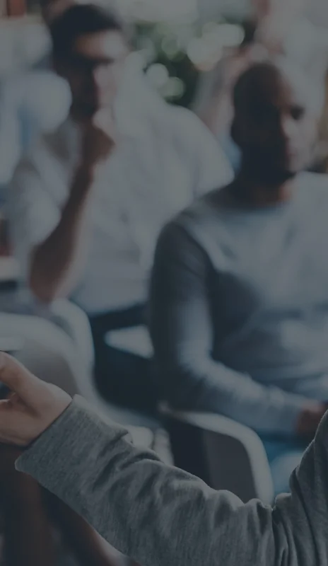 2 people sitting in a meeting